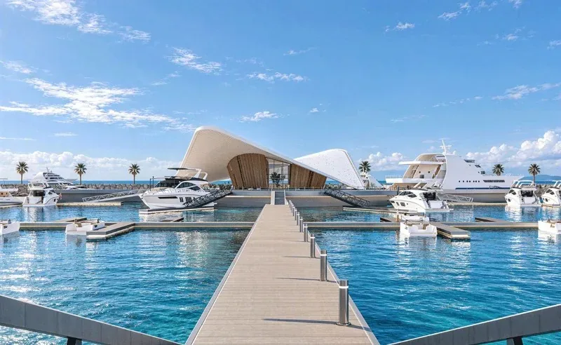 Daytime artist’s impression of the Wynn Marina Capitainerie, with yachts and a central walkway